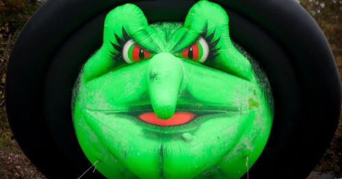 A large green balloon of a witch.