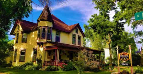 A Queen Anne-style home with a turret.