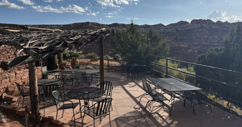 An outdoor patio overlooking rock formations.