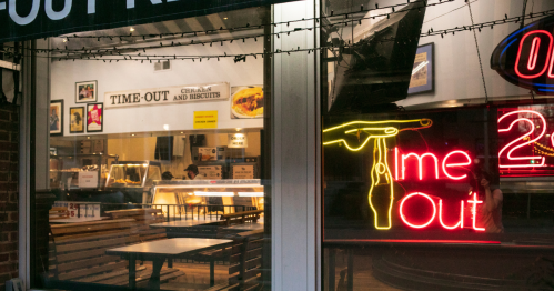 An outside look at the neon signs at Time Out