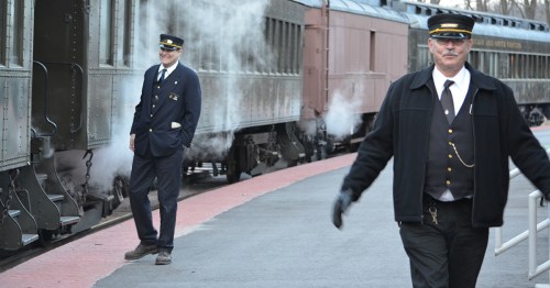 Two train conductors and train