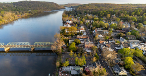 Aerial view of New Hope, PA downtown and the bridge crossing the wide Delaware River.