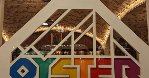 The multi-colored sign reading "Oyster" leading to the Grand Central Oyster Bar.