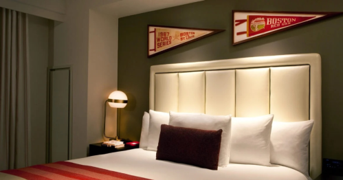 The bed inside the Fenway Suite at Hotel Commonwealth themed for the Red Sox