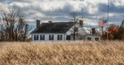Seabrook–Wilson House behind a grass field in the fall