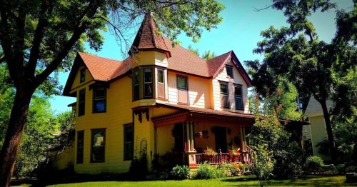 A Queen Anne-style home with a turret.
