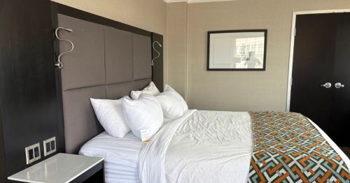 A bed in a hotel room.
