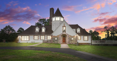 A dusk view of a castle-like Airbnb in the Poconos