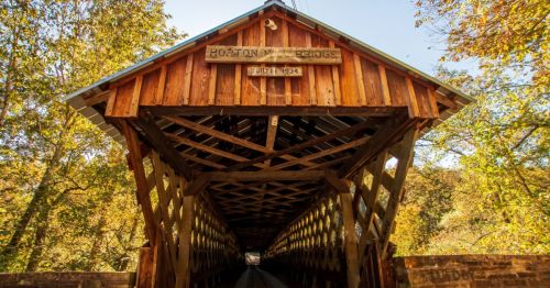 Horton Mill Covered Bridge in Oneonta, Alabama, surrounded by fall foliage.