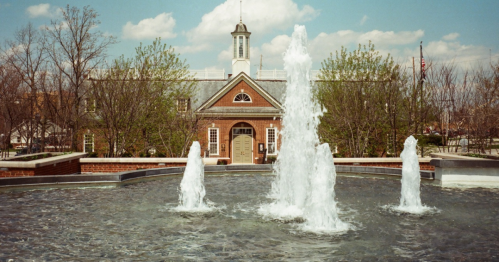 The Carmel, Indiana courthouse with a beautiful water fountain in the foreground.