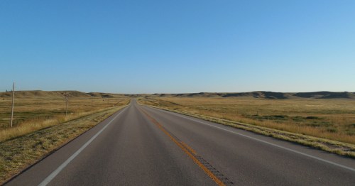 the paved road that leads through big basin preserve in Kansas