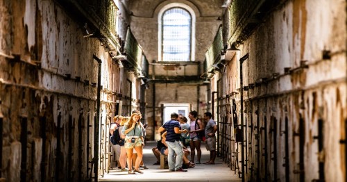 Tourist on a self-guided tour inside Eastern State Penitentiary in Philadelphia.