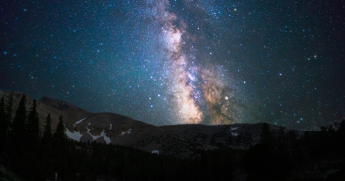 the dark skies over the desert and mountain landscape of great basin national park allow us to see the milky way