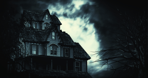 A haunted house sits still during a storm.