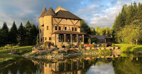 exterior of a castle vacation property on the water in irasburg, vermont