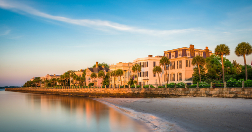 View of the Battery in Charleston, SC, lined with palm trees and historic homes
