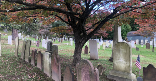Tombstones at Sleepy Hollow Cemetery in the fall