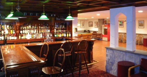Tavern-inspired basement in a NH castle
