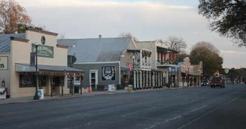 Festive Main Street in Boerne, one of the most charming small towns in Texas, with historic buildings and twinkling holiday lights decorating local shops and restaurants.