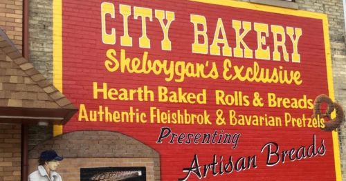 Mural that reads "City Bakery" on brick wall