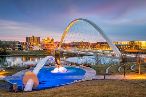 Des Moines, Iowa skyline featuring modern downtown buildings under a clear sky.