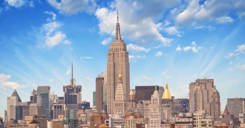A daytime view of the New York City skyline, focusing on the Empire State Building.