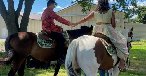 Teenagers on horses at the farmhouse rental entrance. Enjoy horseback riding on your farm stay.