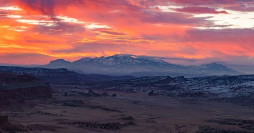 A fiery sky illuminates the Henry Mountains and the area near Hanksville, Utah.