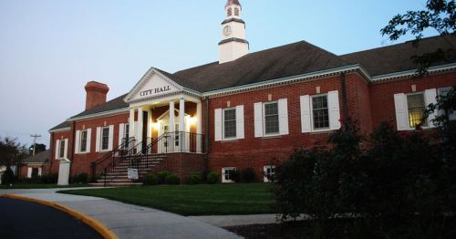 a red brick city hall building.