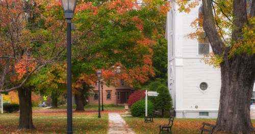 A colorful autumn view of a park in the Manchester, Vermont Historic District.