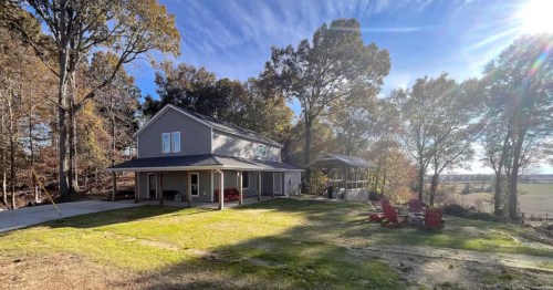 The exterior of an Airbnb in Mississippi overlooking farmland.