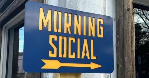 Blue and yellow Morning Social welcome sign.