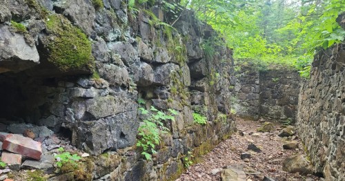 The Arnold Mine sits crumbling in the sunlight.