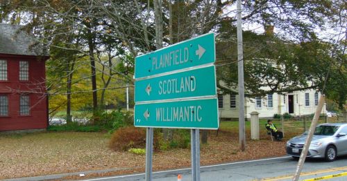 A road sign displaying three cities.