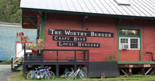The exterior of the Worthy Burger restaurant in South Royalton, Vermont. The restaurant is housed in a red, renovated freight house.