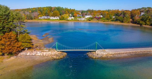 aerial shot of the wiggly bridge between two small peninsulas in York, maine during the fall