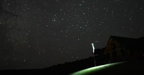A starry night/dark sky view from the front of a guest house in Nevada.