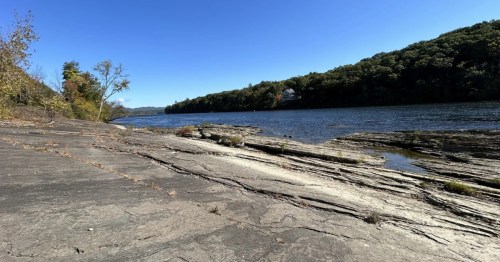 view of sandstone along the river at dinosaur footprints trail in holyoke massachusetts