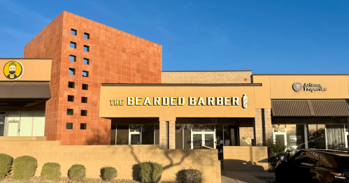 Exterior of the bearded barber, a barber shop with a speakeasy in an unassuming shopping plaza in anthem massachusetts