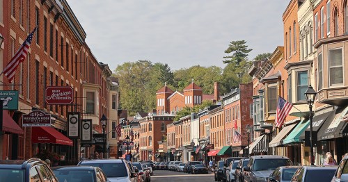A main street is lined by historic brick buildings.