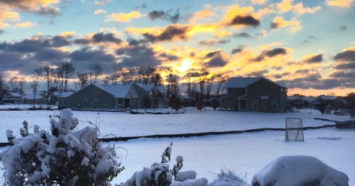 The sun rises over a wintry scene in Maineville, Ohio.