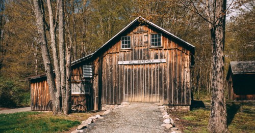 exterior of a barn-lie structure at mill brook village a historic site in new jersey