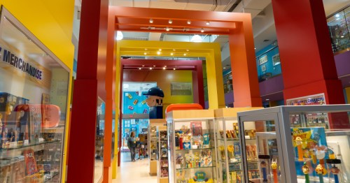 interior of the pez visitor museum with colorful paint and displays filled with pez dispensers in orange ct