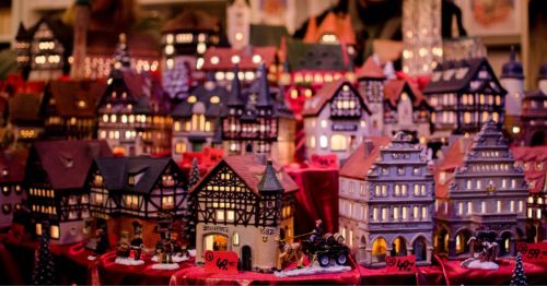 A close-up of small Bavarian buildings that are holiday gifts.