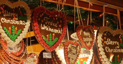 Giant heart-shaped German cookies with festive sayings on them.