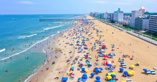 Aerial view of a crowded beach at the Virginia Beach ocean front looking south.