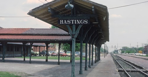 Historic open-air railway platform and signage for the Hastings train station.