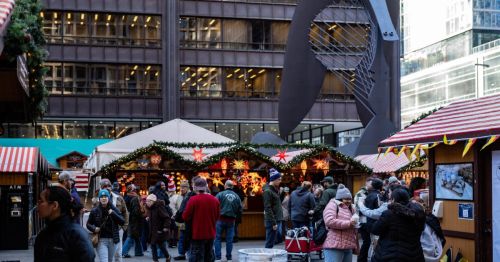 People outside are attending a Christmas market in Chicago’s Daley Plaza.