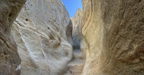 The interior of a slot canyon with rock steps in Southern California.