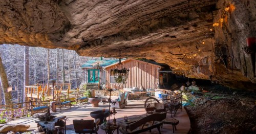 The inside of a cabin in a cave, a trending vacation rental in Alabama.